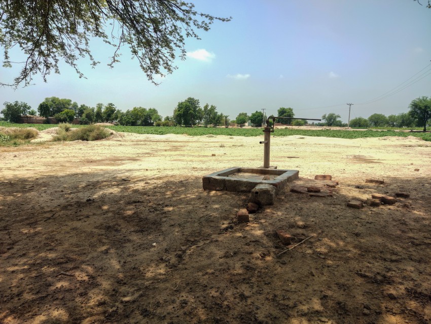 A clean water tap for drinking in a shady place