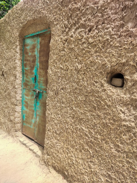 A mud room with an iron door closeup footage, old architecture stock footage