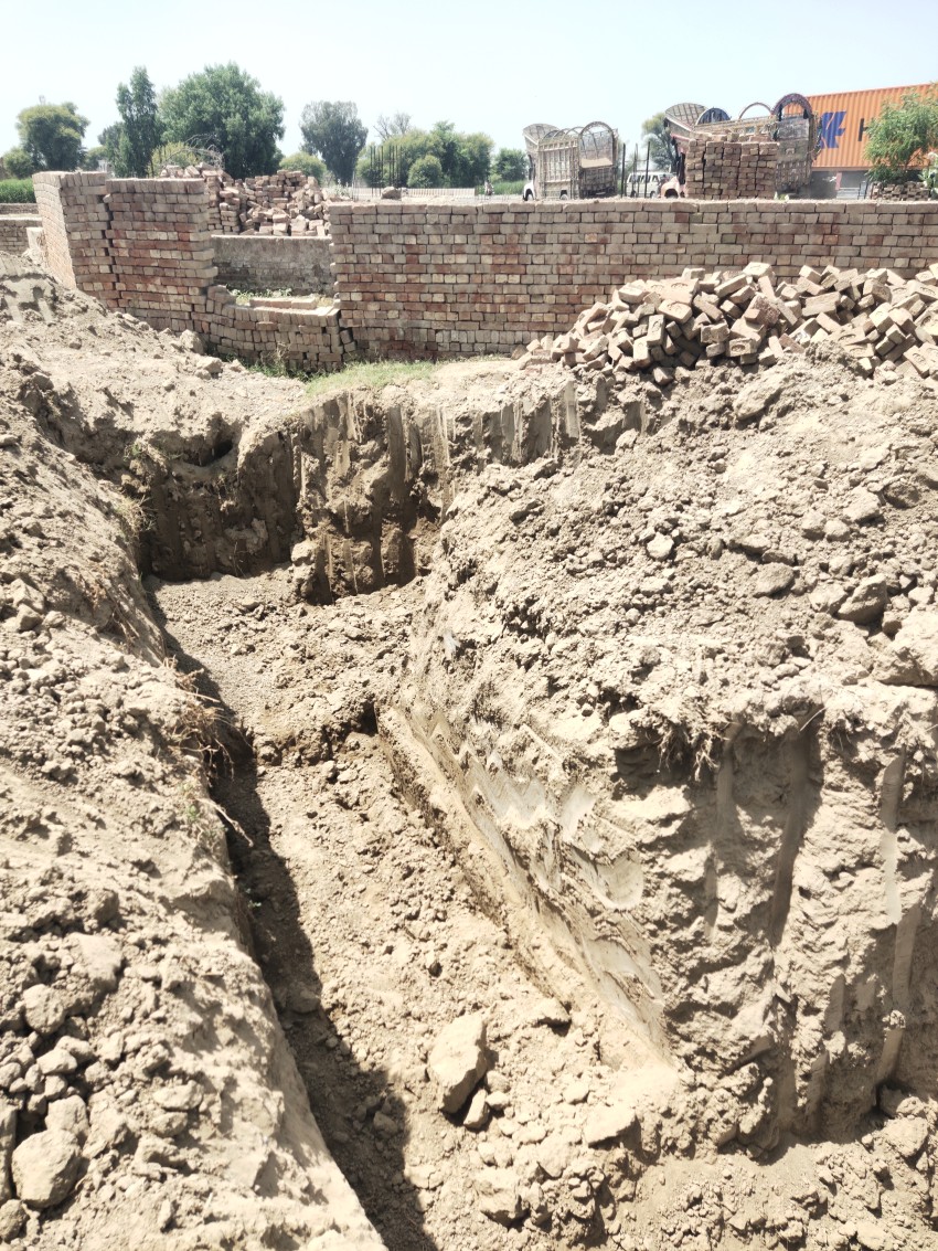 A view of the excavation by crane for the foundation along the National Highway