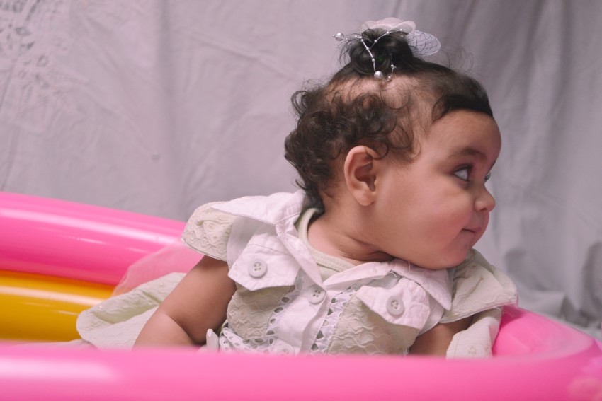 Baby photography   relaxed while looking at her left
