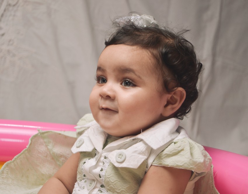 Baby photography   smiling by looking at something