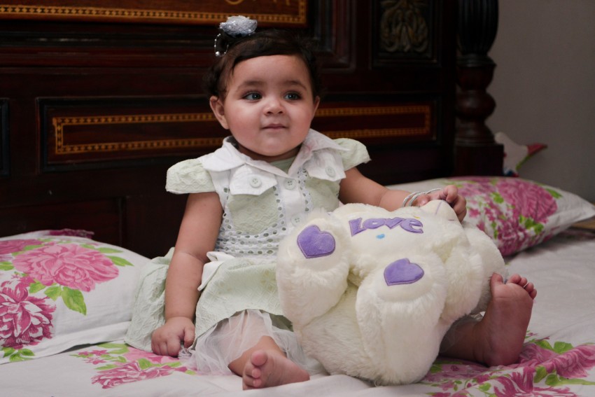 Baby photography   with white bear looking