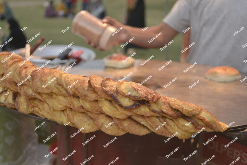 Bun kabab burger Patties on a huge iron pan or tava