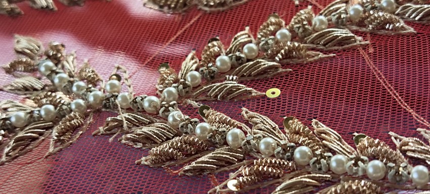 Fine embroidery on women's frocks with stars and beads