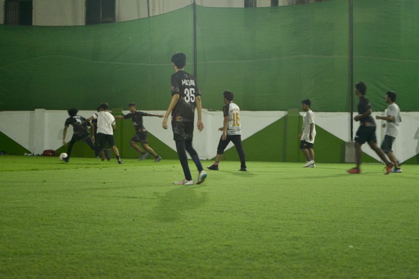 Futsal court Karachi team playing in a green floor ground night match