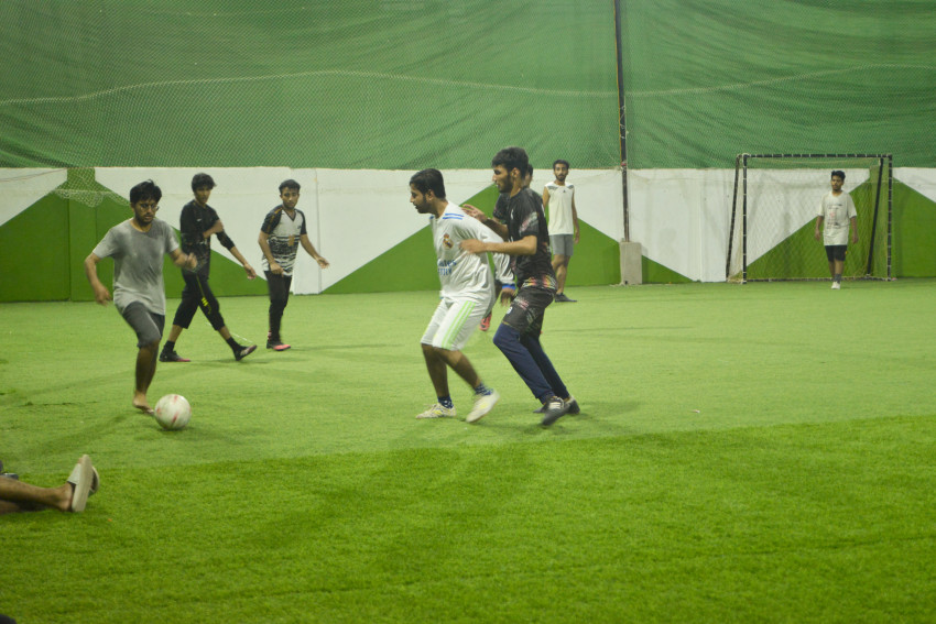 Futsal court Karachi team playing in a green floor ground night match