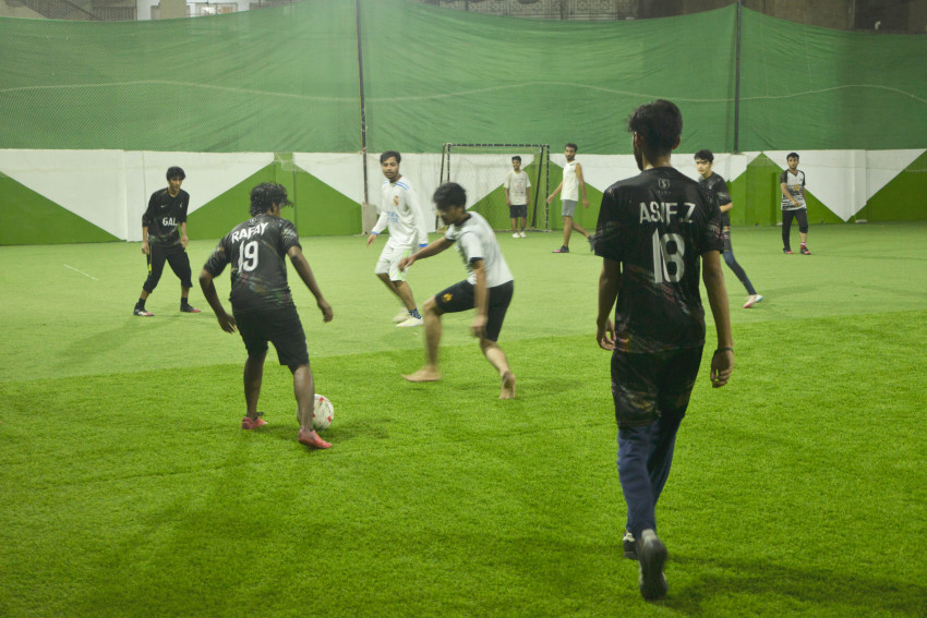 Futsal court Karachi team playing in a green floor ground night match