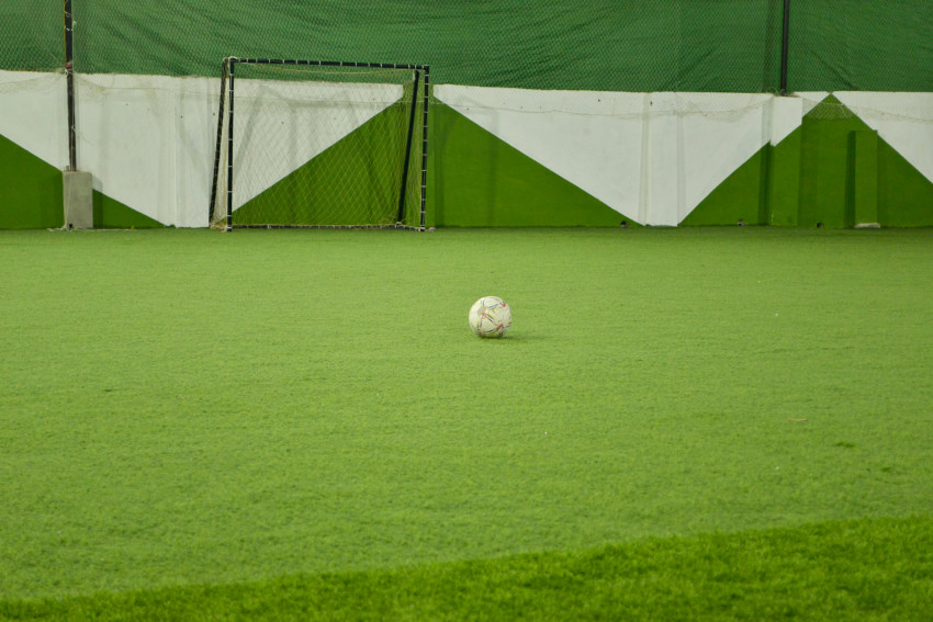 Futsal court Karachi team playing in a green floor ground night match