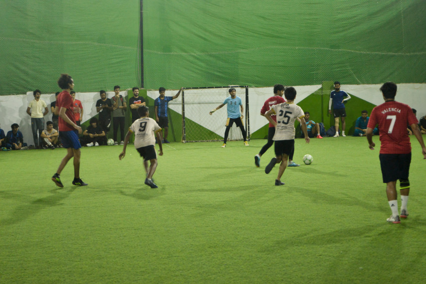 Futsal court Karachi team playing in a green floor ground night match