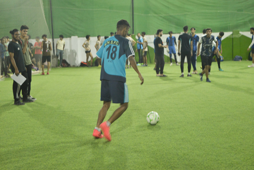 Futsal court Karachi team playing in a green floor ground night match