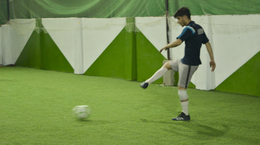 Futsal court Karachi team playing in a green floor ground night match