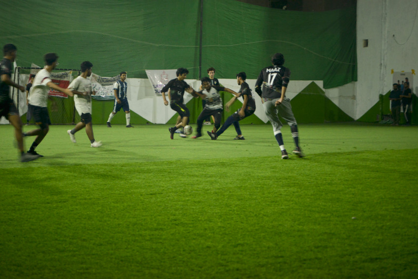 Futsal Tournament Karachi team playing in a green floor ground