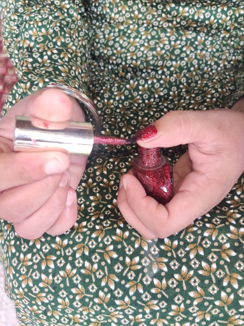 Girl applying nail polish on her nails front view, fashion stock footage