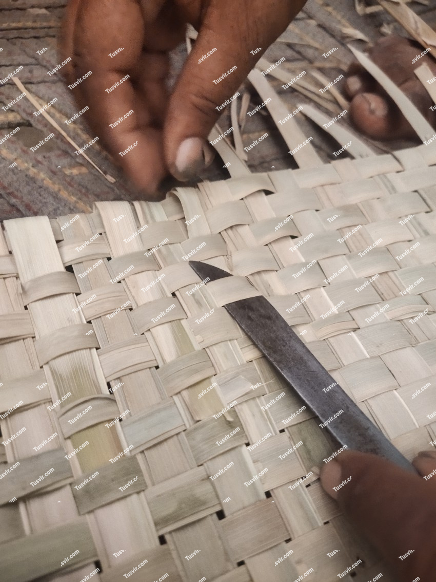 Home made hand fan in the Village, Fan of Dates leaves
