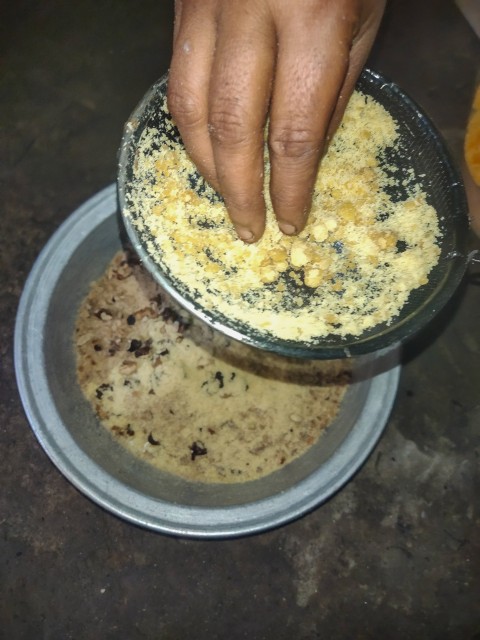 Jaggery is being added after dry fruits in chori made from flour