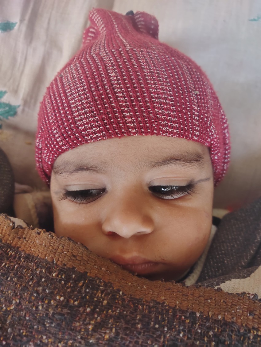 Little baby wearing winter clothes, baby face stock footage