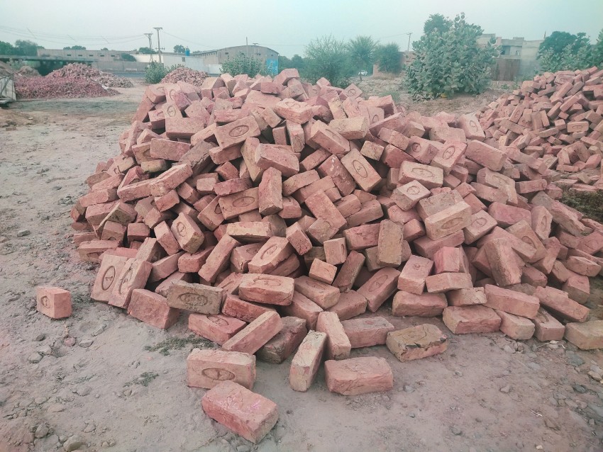 Lots of red bricks to be used for shop construction