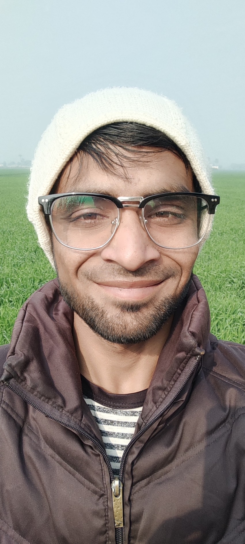 Pakistani young boy walking in the village in winter