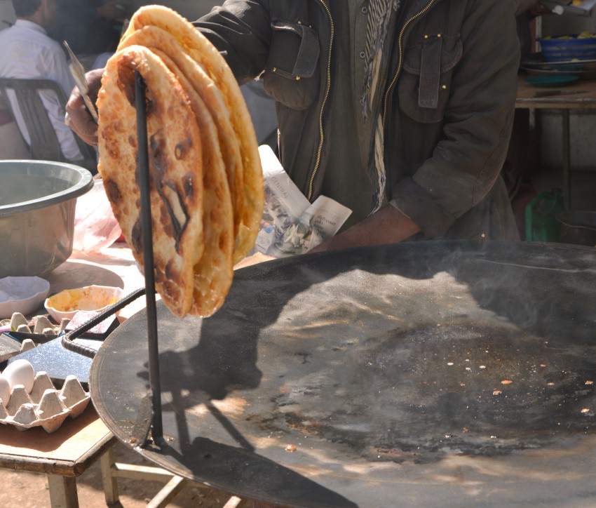 Paratha or flat fried bread on a iron tava