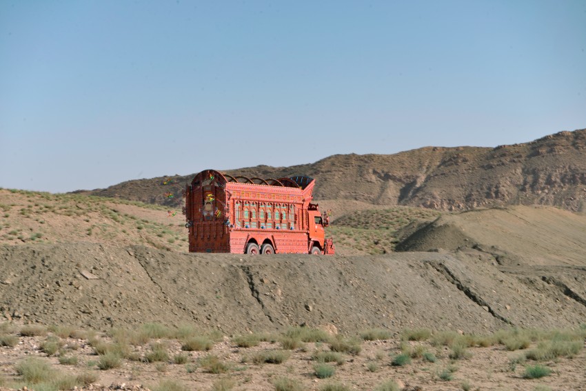Red color truck on a road