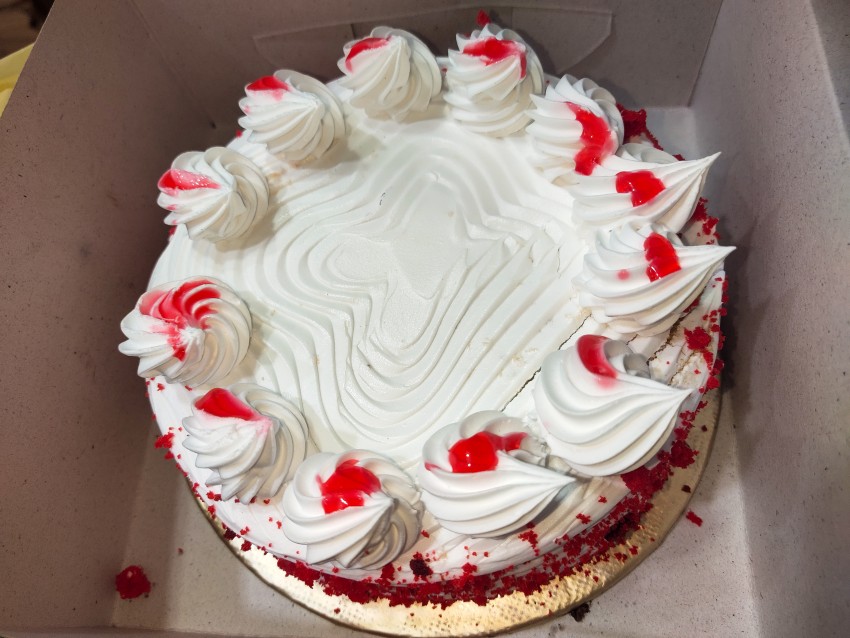 Red Velvet Grandeur Cake, Creamy, pineapple-filled cake.