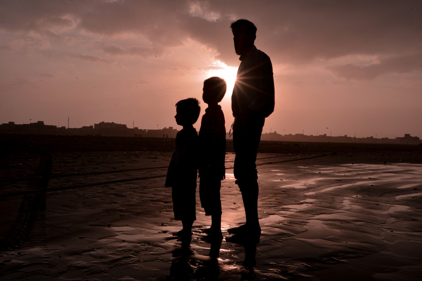 Single Dad Sun Rise and Person Silhouette at Sea View, Karachi