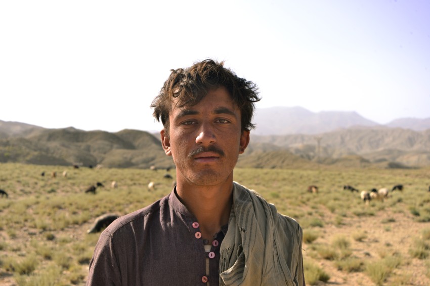 Young shepherd in mountains