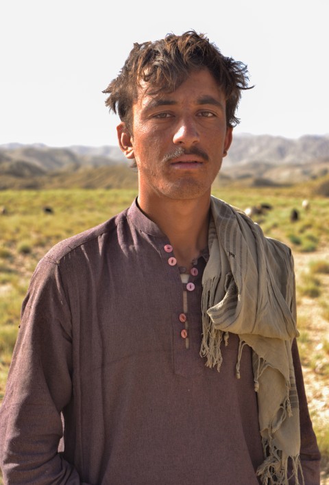 Young shepherd in mountains