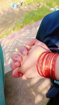 Boy and Girl hand in hand together with bangles in girl's hand